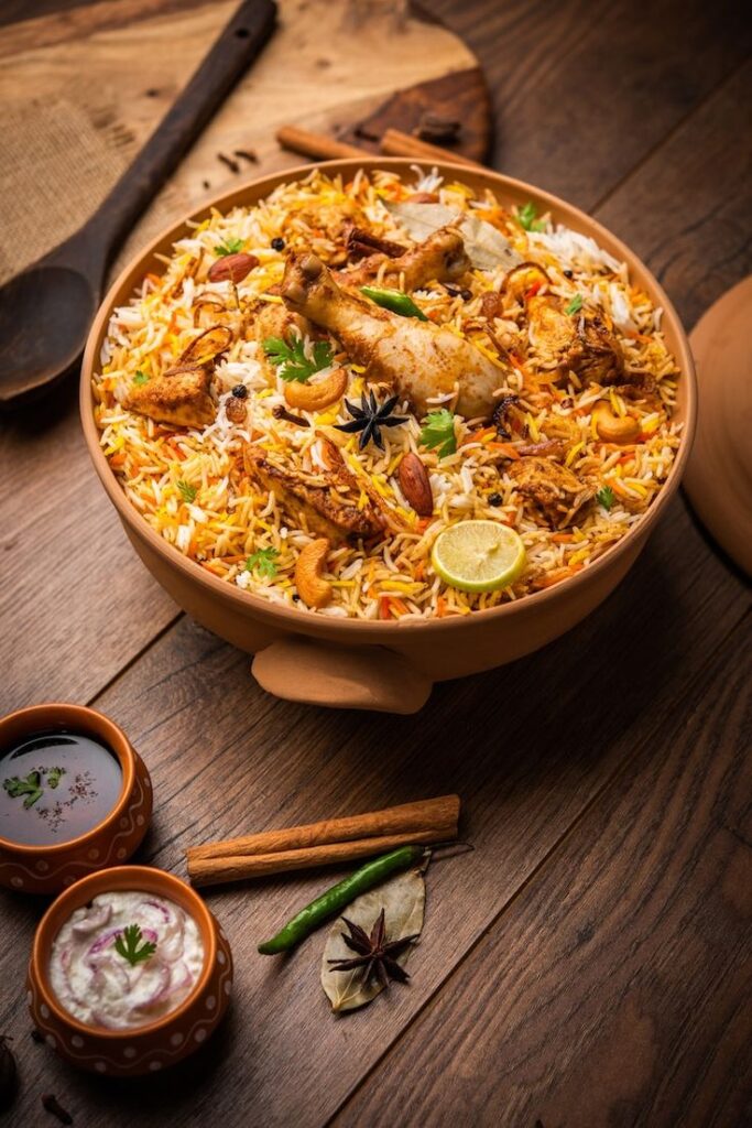 dum handi chicken biryani is prepared in an earthen or clay pot called haandi popular indian non vegetarian food premium photo